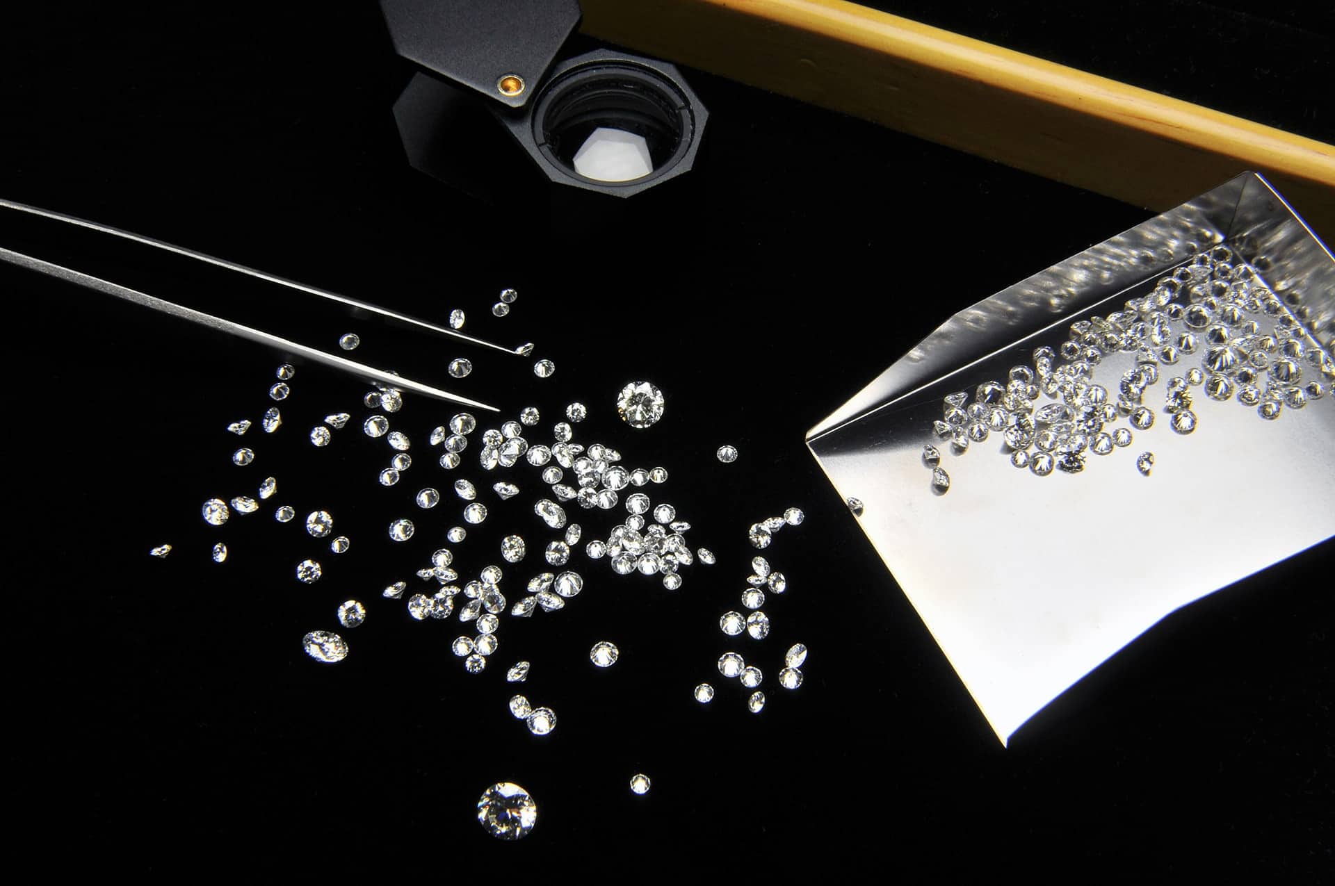 Diamonds scattered on a table from a concierge experience with xennox