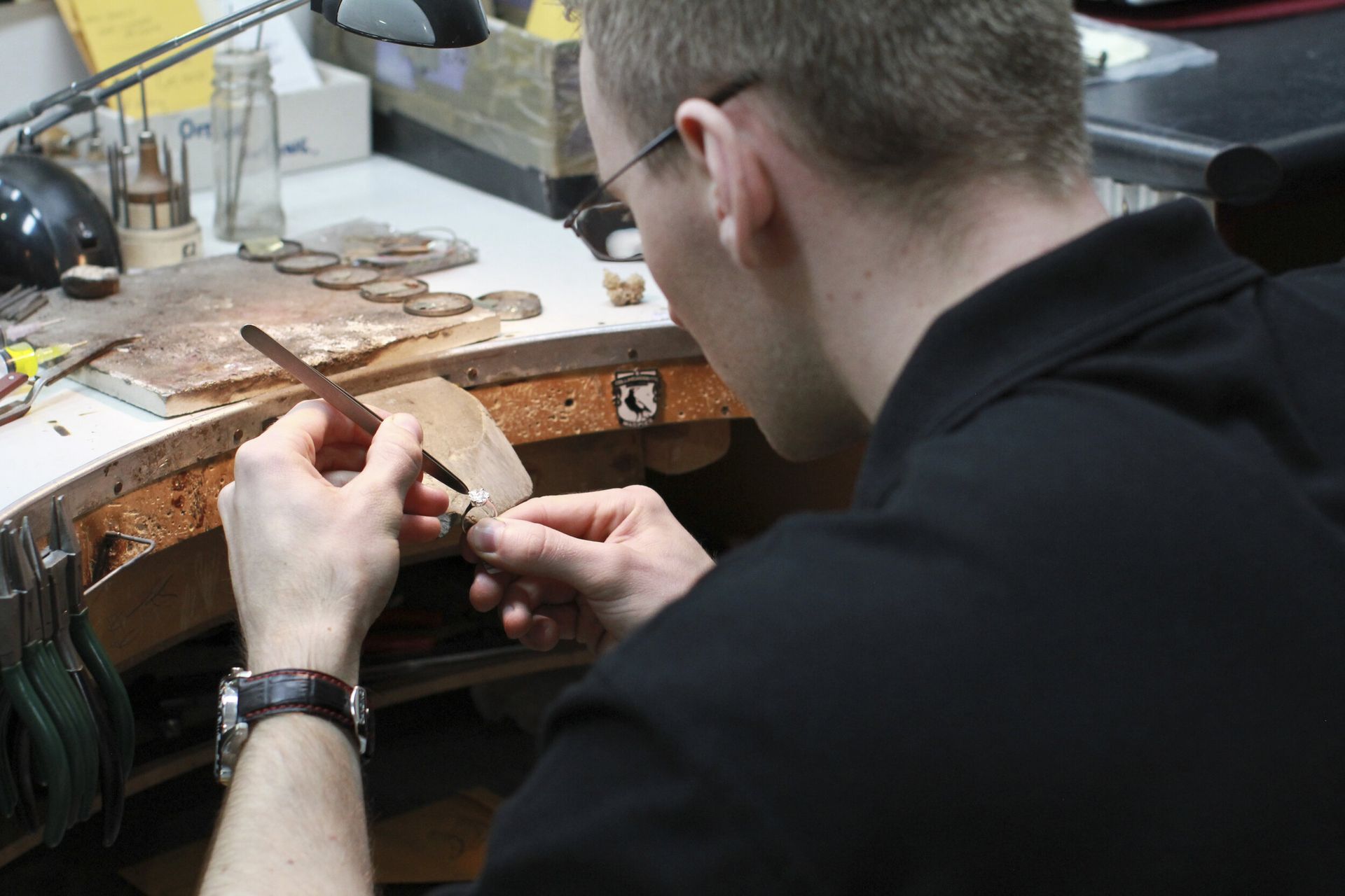 Diamond setter creating a bespoke engagement ring